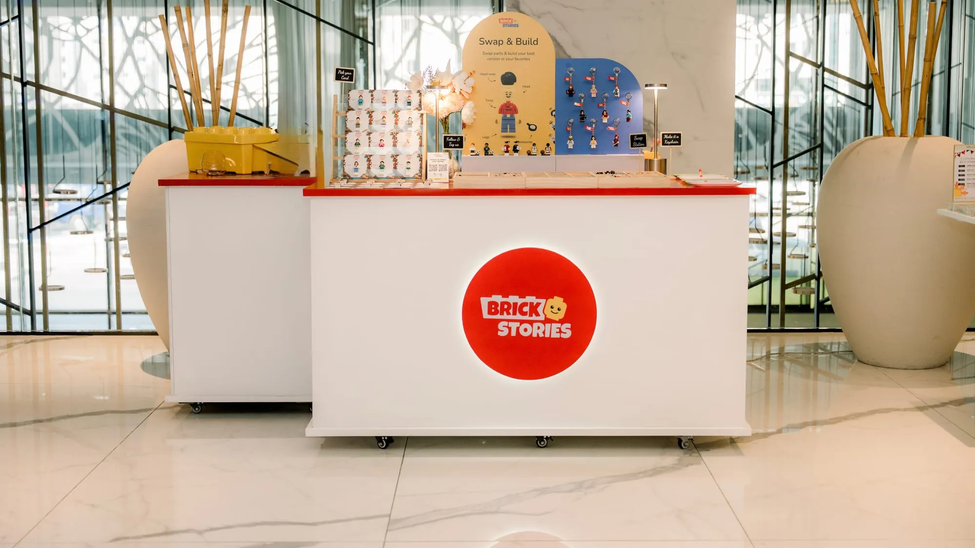A mini figure building booth set up at a 50th birthday in Dubai, before guests arrive