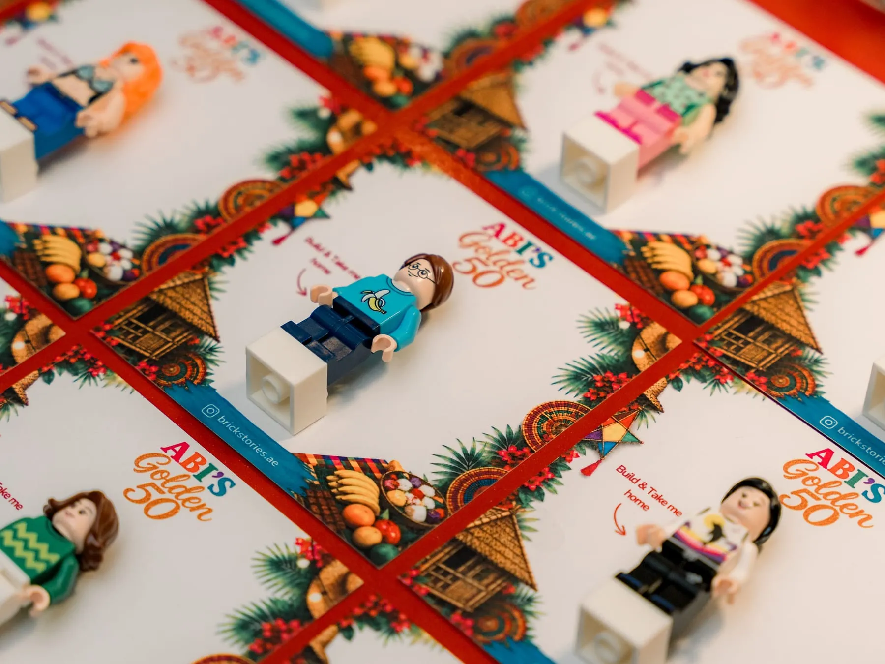 Mini figures on backing cards custom designed for a 50th birthday celebration in Dubai
