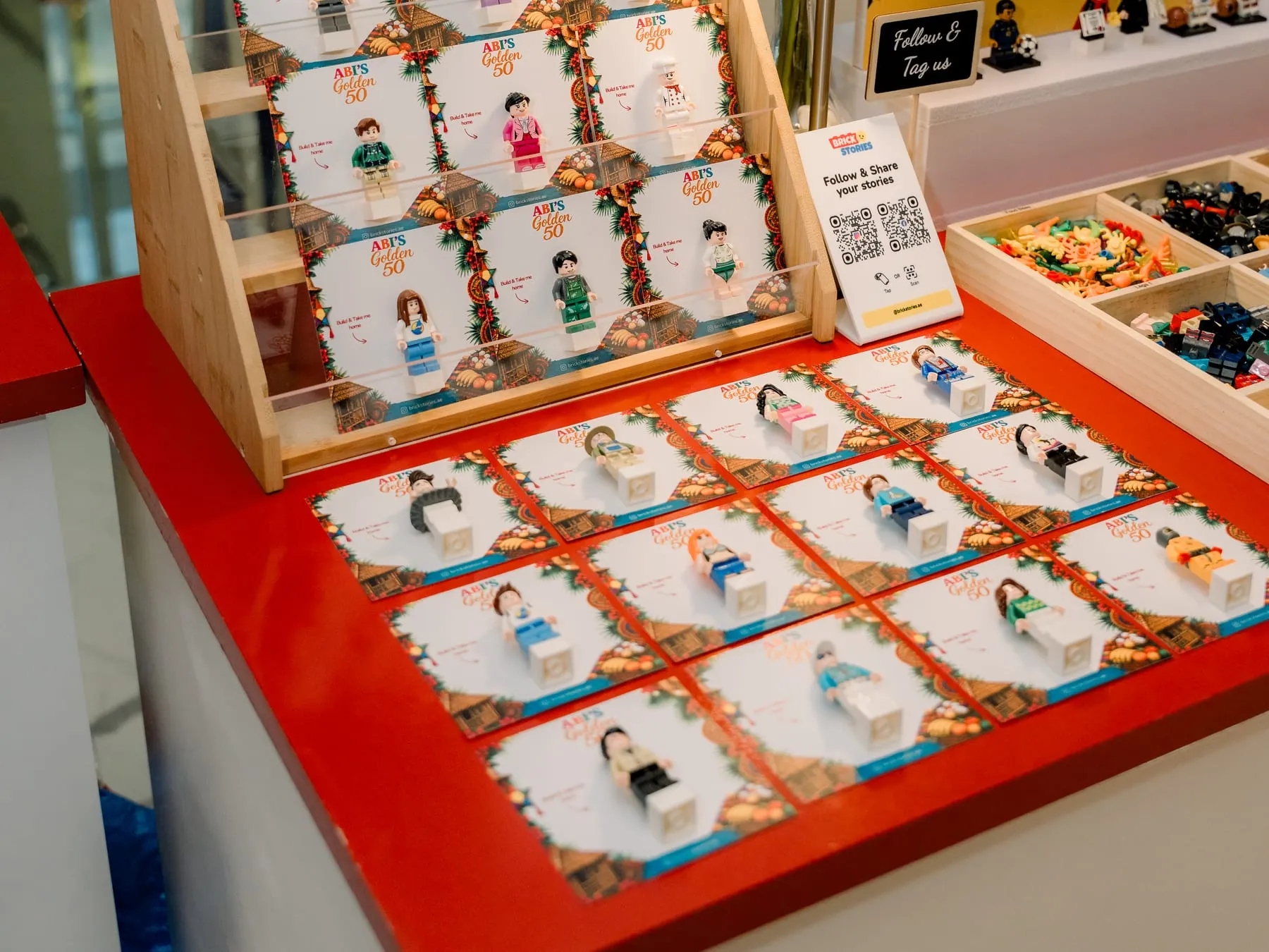 A fully styled mini figure setup with both a keepsake table and a custom guestbook frame