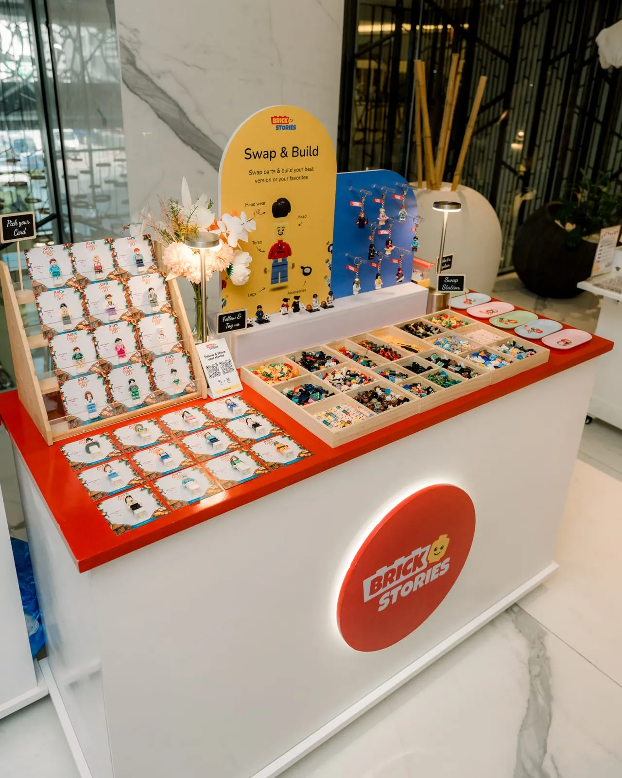 A styled mini figure display set up at a venue before guests arrive